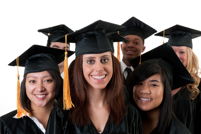 A multi ethnic group of graduates in graduation gowns